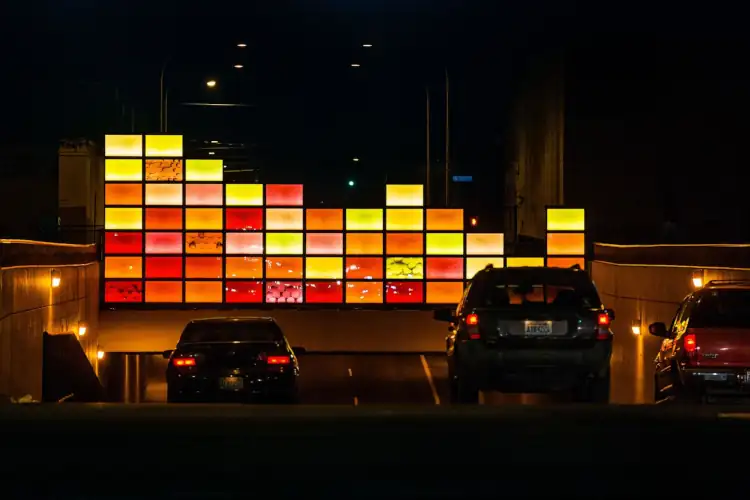 a picture of the bins of light public art piece at night